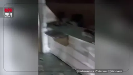 لحظه به آتش کشیده شدن یک بانک توسط اغتشاشگران