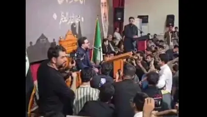 تصویر رهبر انقلاب در یک محفل قرآنی در عراق