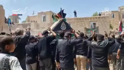 آیین نخل گردانی ظهر عاشورا در روستای تیران